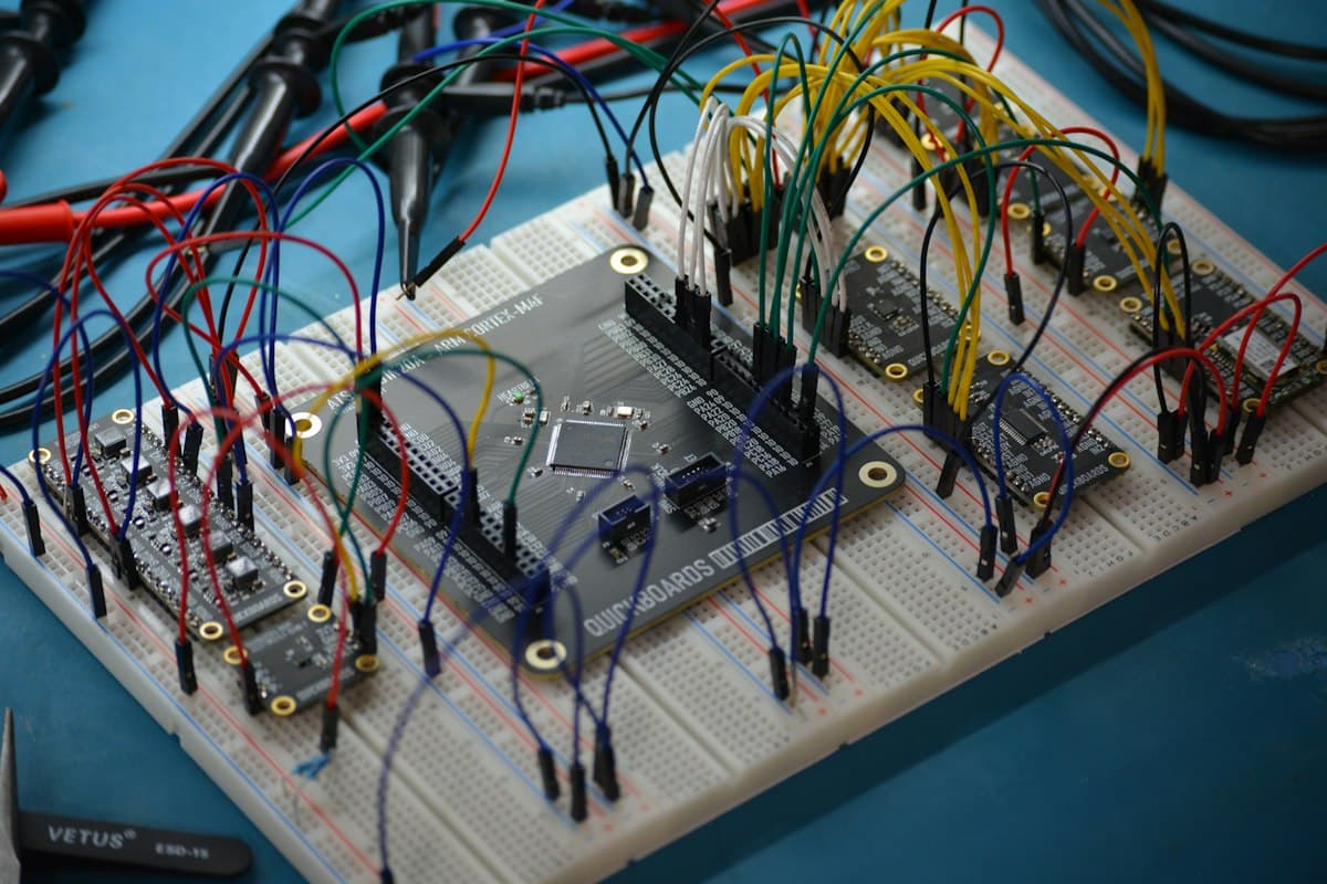 Microcontroller development board wired to a breadboard